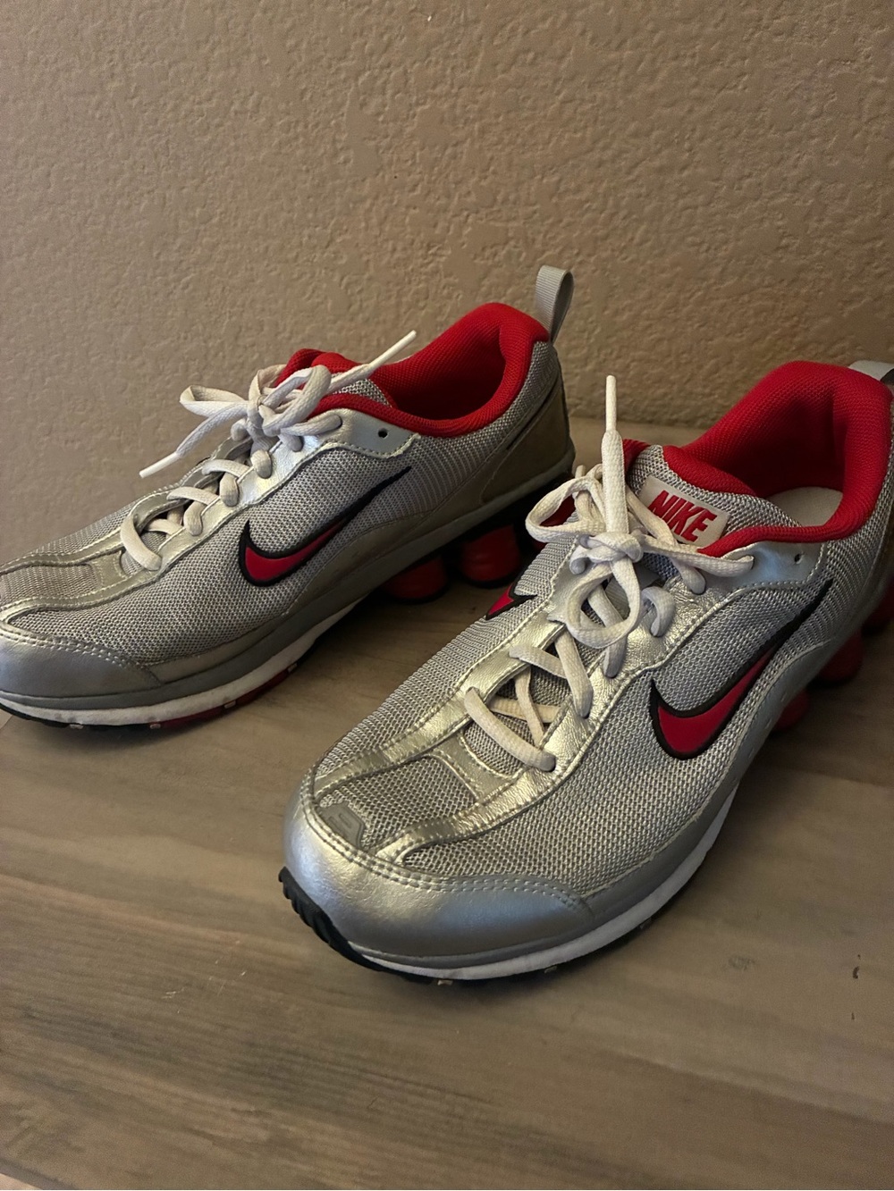 Nike Silver Sneakers with Red Swoosh